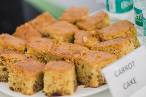 square slices of carrot cake on a plate